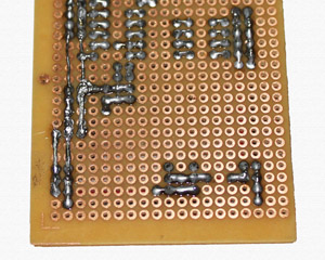 Solder to connect two sides of board